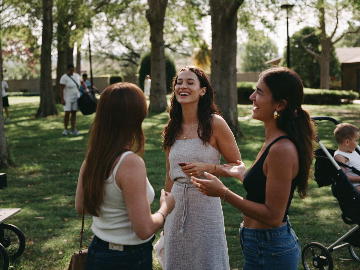 Two neighbors talking in a park